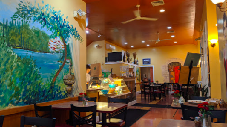 Immerse yourself in the Quintessential New England Charm of Groton Massachusetts while dining at our restaurant adorned with a vibrant mural on the wall.