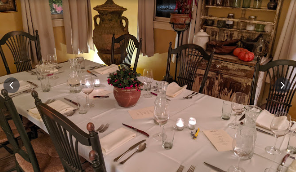 An image of a table set for a quintessential dinner party in Groton Massachusetts.